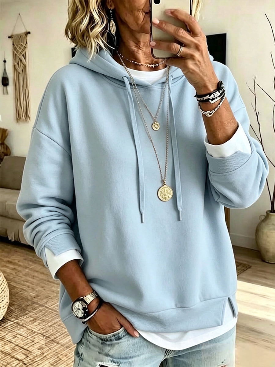 Casual White Hooded Sweatshirt With Color-block Detailing And A Layered-look Design.