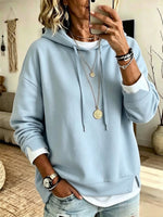 Casual White Hooded Sweatshirt With Color-block Detailing And A Layered-look Design.