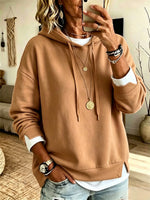 Casual White Hooded Sweatshirt With Color-block Detailing And A Layered-look Design.