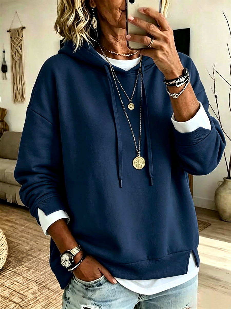 Casual White Hooded Sweatshirt With Color-block Detailing And A Layered-look Design.